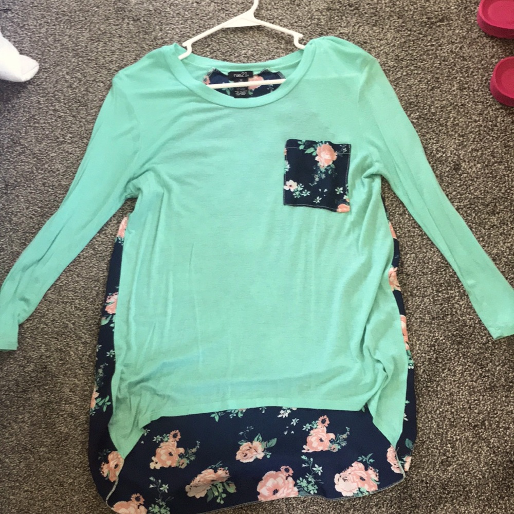 Blue long sleeved shirt. Longer floral back. Rue21 Medium
